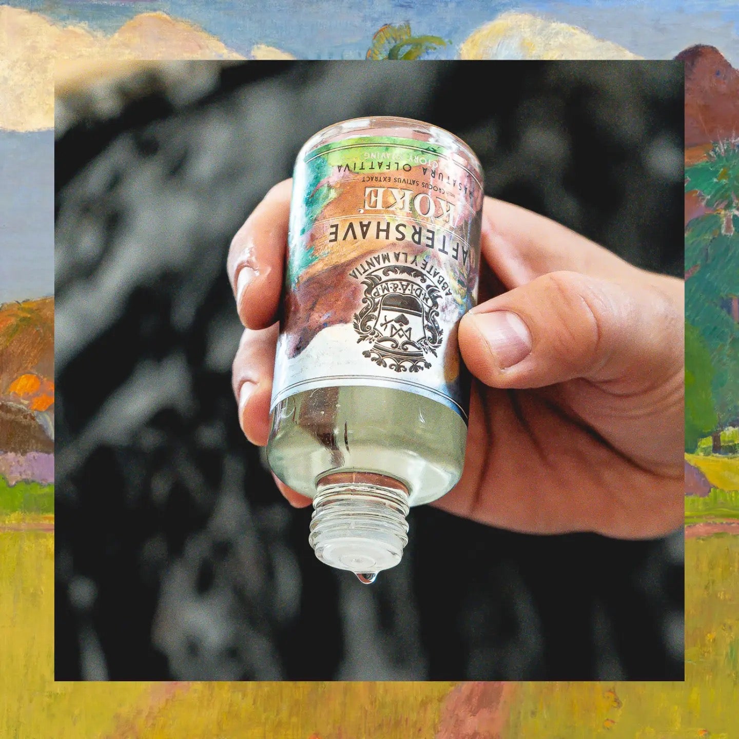 Hand holding a bottle of aftershave with a scenic background