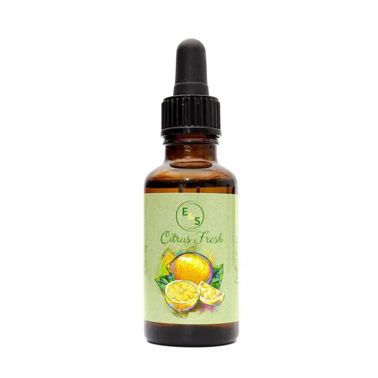 Bottle of Citrus Fresh essential oil with a dropper on a white background