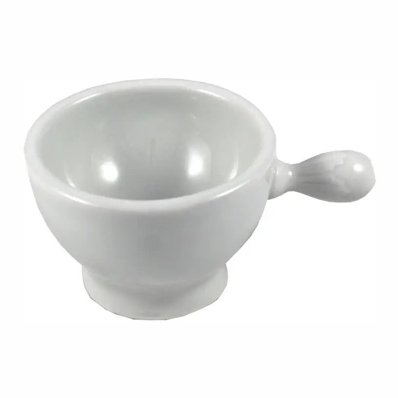 White ceramic cup with handle on a white background
