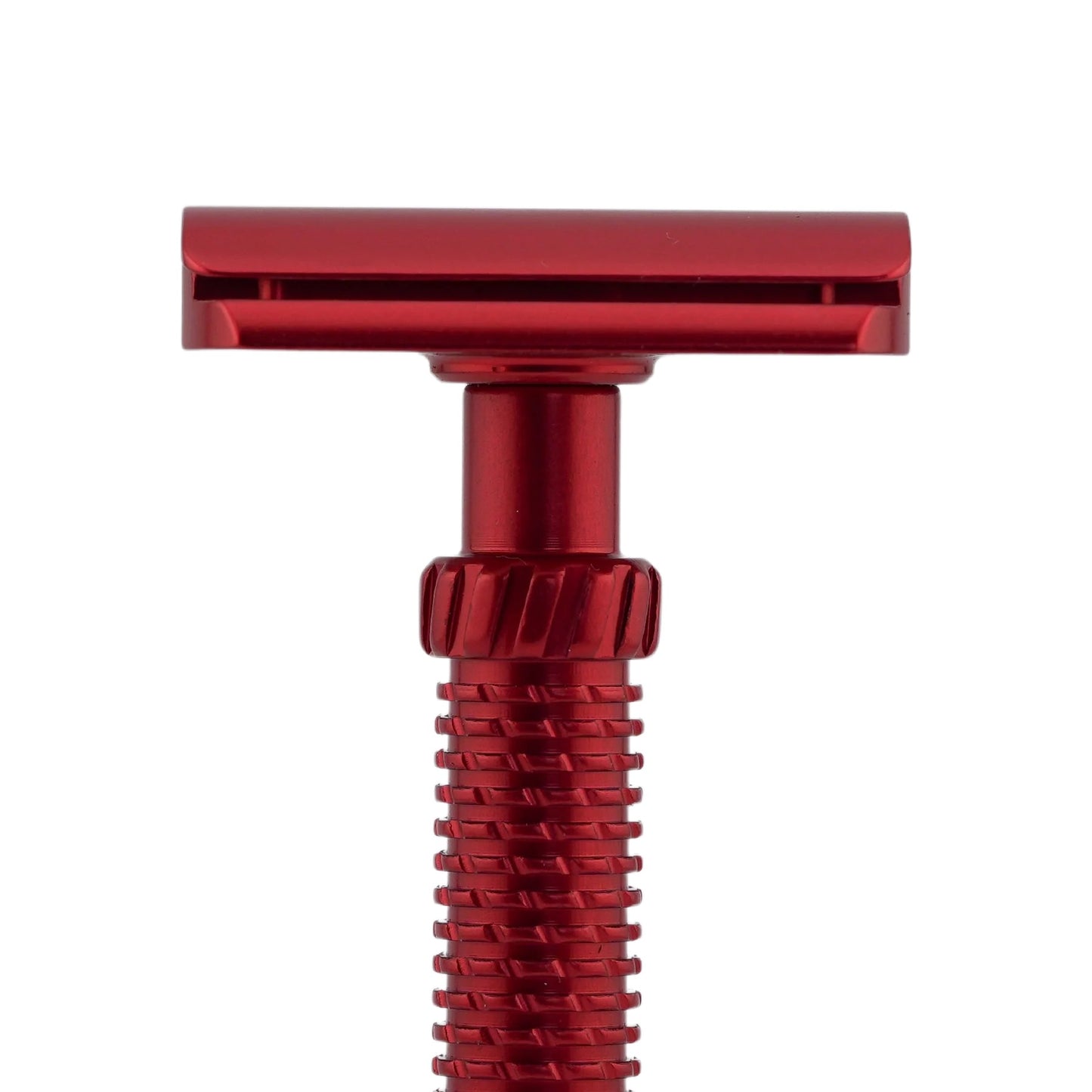 Red safety razor on a white background
