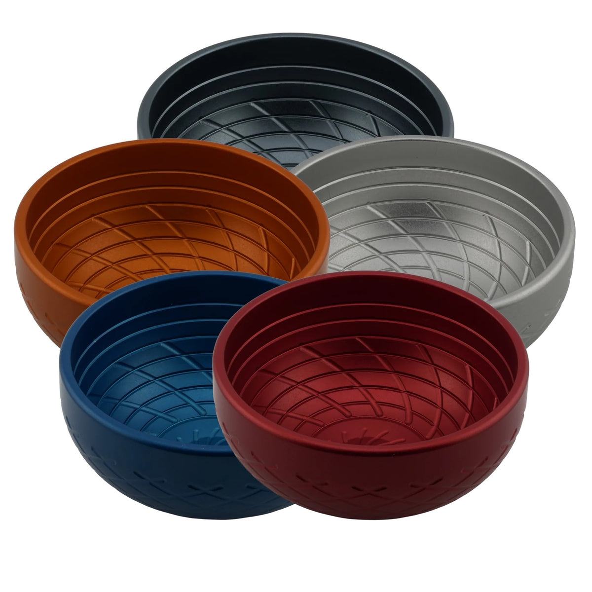Set of five woven silicone bowls in different colors on a white background