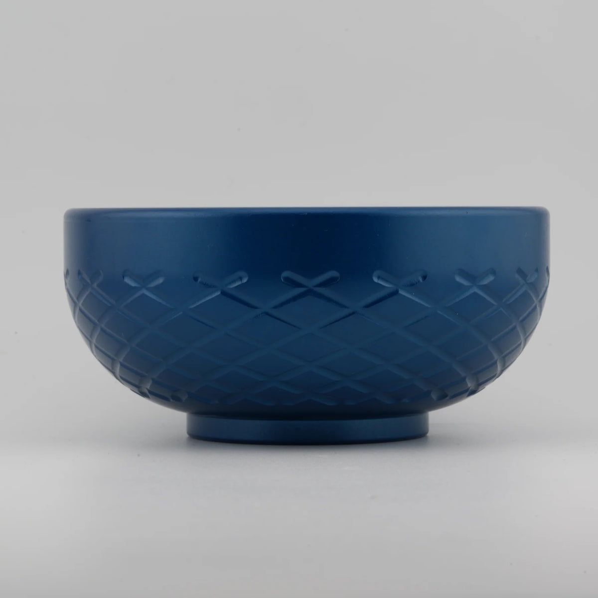 Blue textured bowl on a gray background