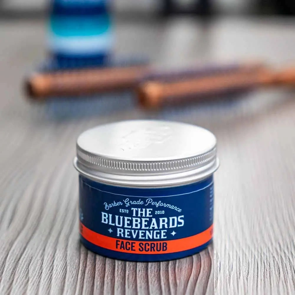 Bluebeards Revenge face scrub jar on a wooden surface with blurred background