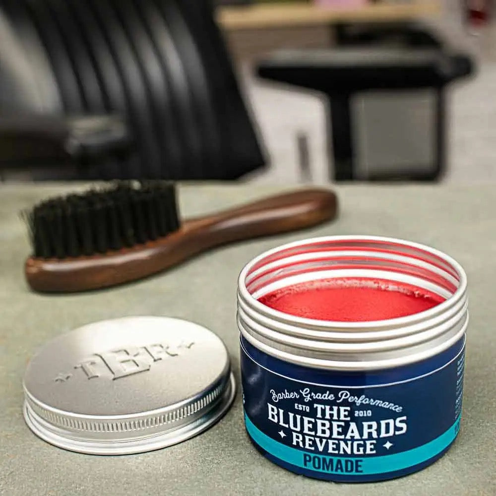 Bluebeards Revenge pomade jar with brush on a counter