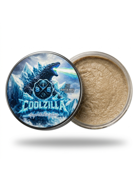 Jar of gold powder with a 'Godzilla' design on the lid against a white background