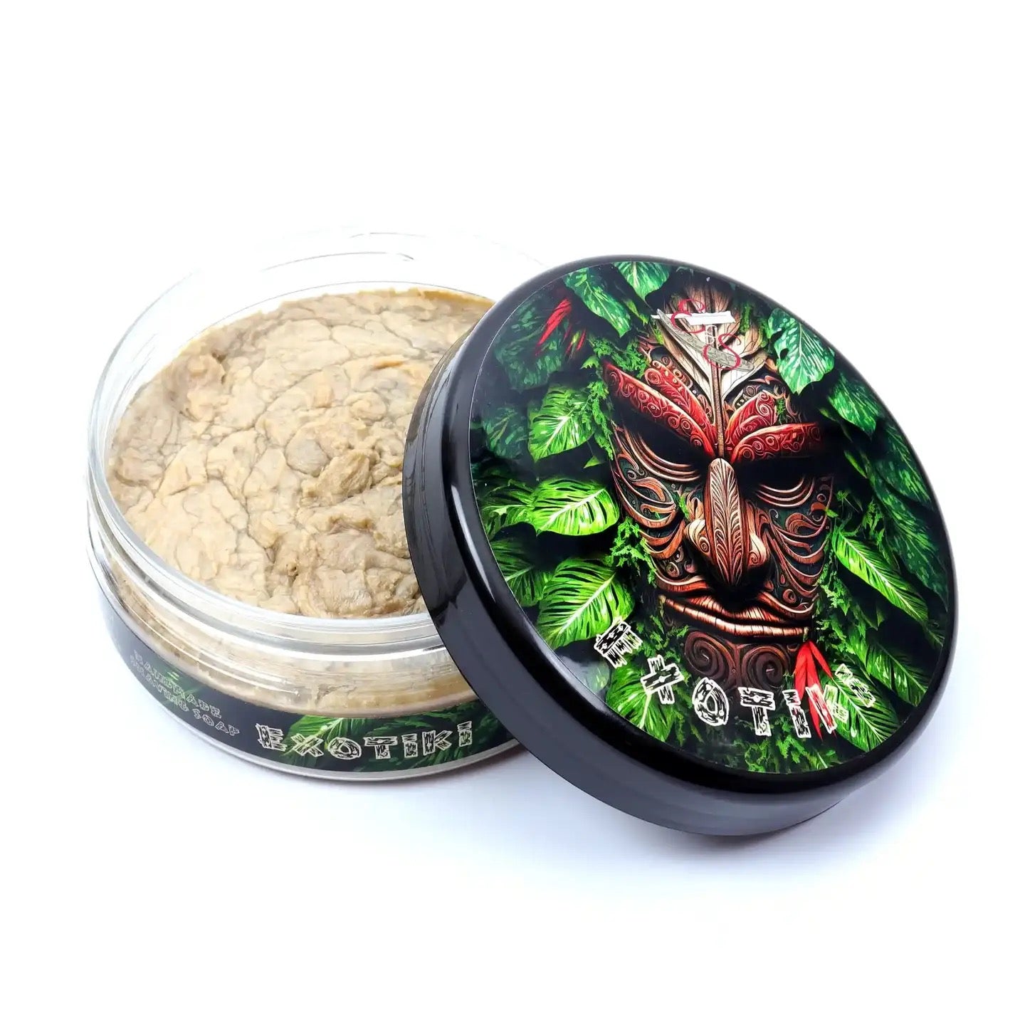 Open jar of cannabis with decorative lid featuring a mask design on a white background