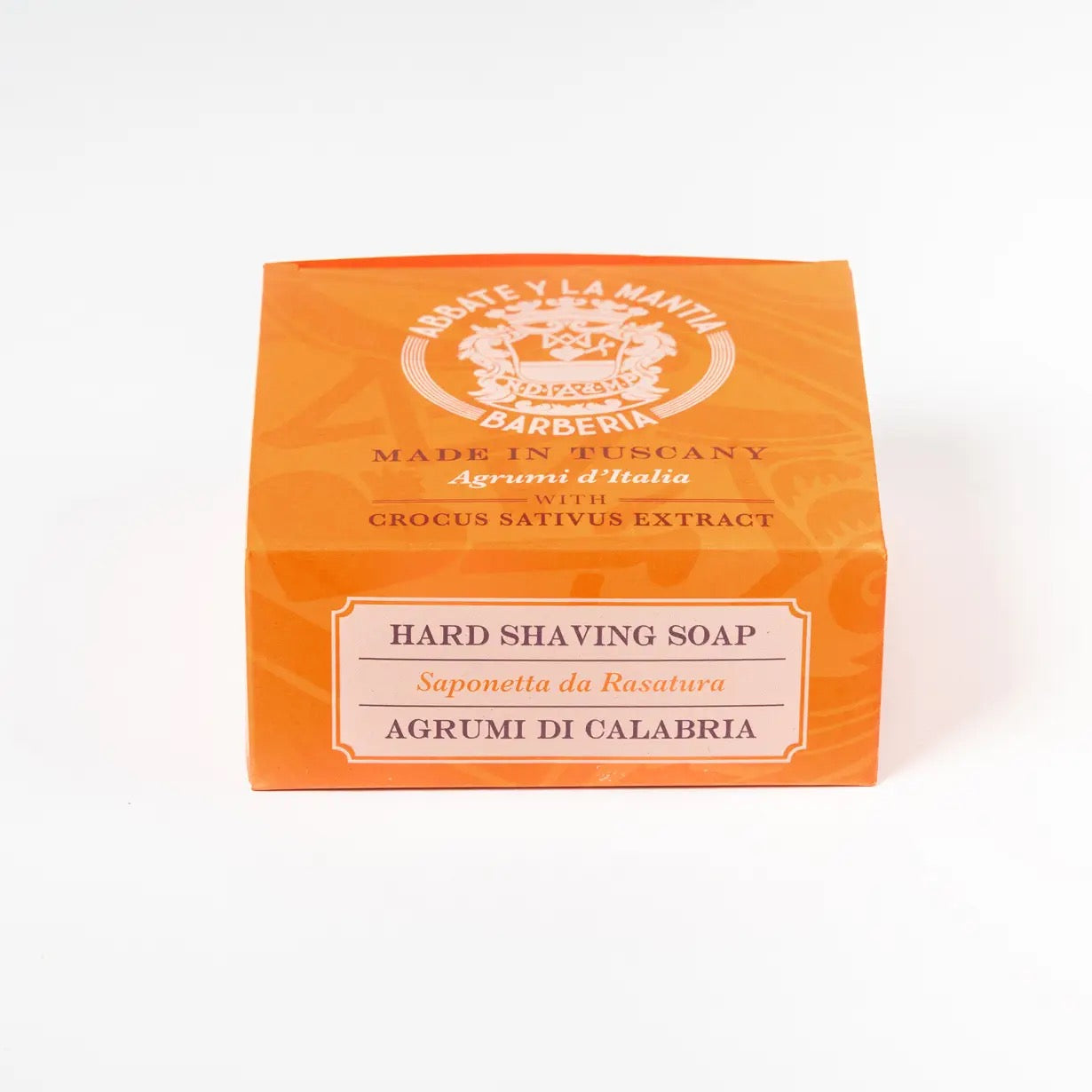 Orange box of hard shaving soap with branding on a white background