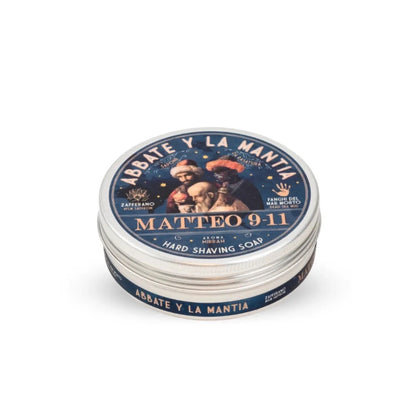 Stack of Abbate y La Mantia hard shaving soap containers on a white background