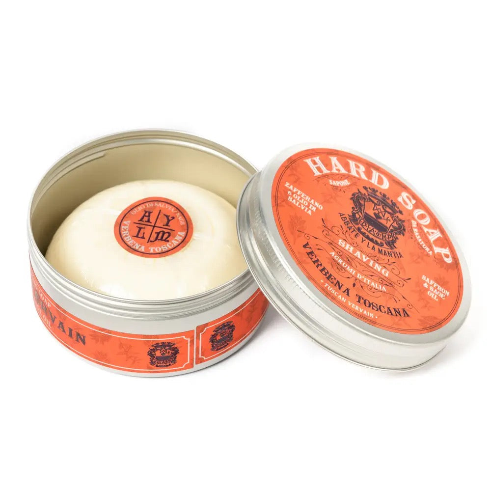 Hard soap in a metal tin with a red label on a white background