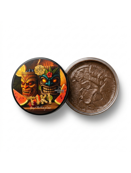 Tiki-themed container with a lid featuring two colorful tiki faces and a coin inside on a white background.