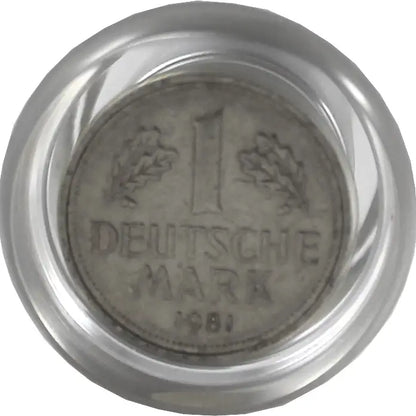Silver coin with '1 Deutsche Mark 1981' text in a protective holder.