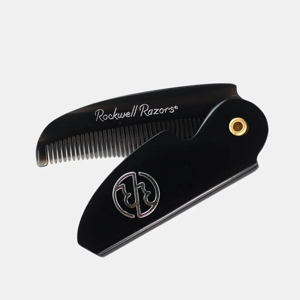 Black comb with gold accent on a white background, featuring 'Rockwell Razors' branding.