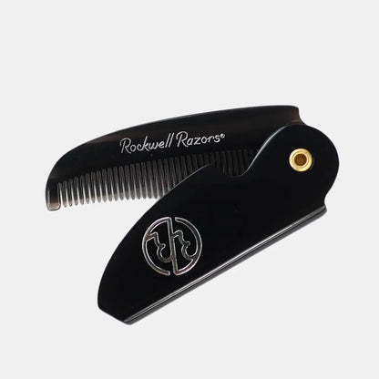 Black comb with gold accent on a white background, featuring 'Rockwell Razors' branding.