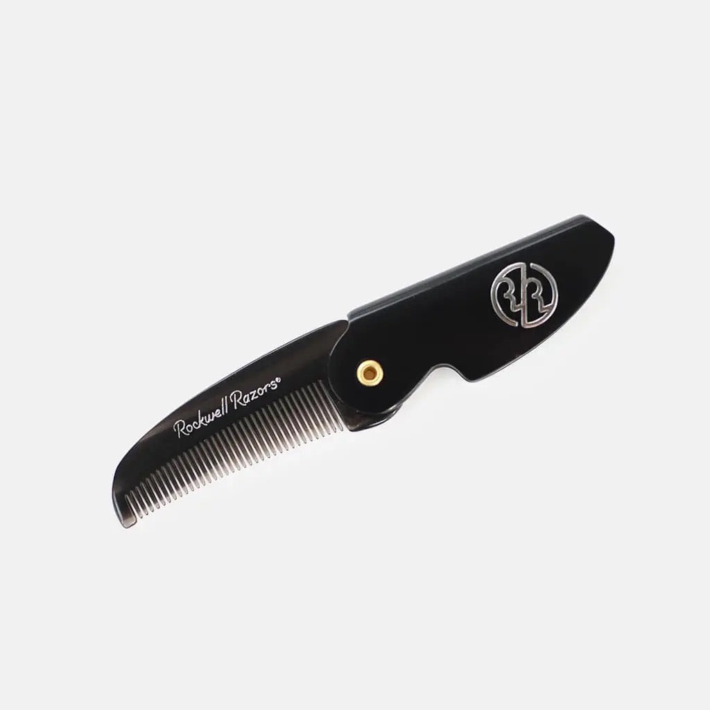 Black comb with visible branding on a white background