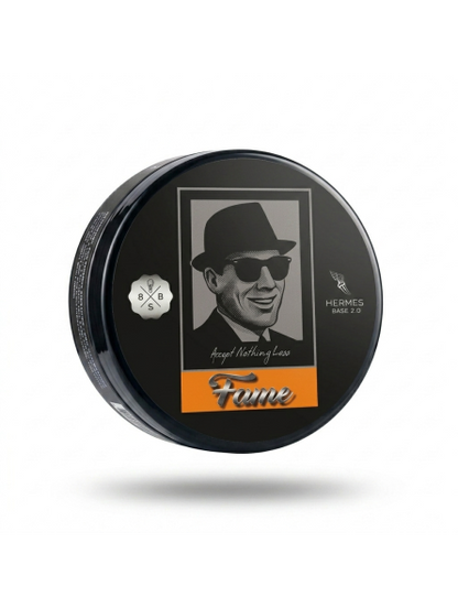 Black container with a portrait of a man wearing sunglasses and a hat, featuring the brand 'Hermes'.