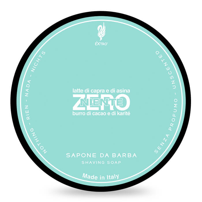 A round tin of EXTRO shaving soap labeled 'ZERO' with a light aqua background, black outer rim, and white text on a white background.