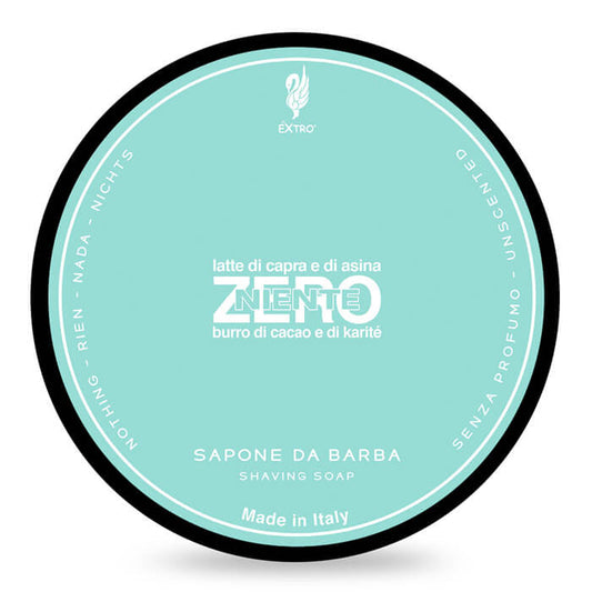 A round tin of EXTRO shaving soap labeled 'ZERO' with a light aqua background, black outer rim, and white text on a white background.